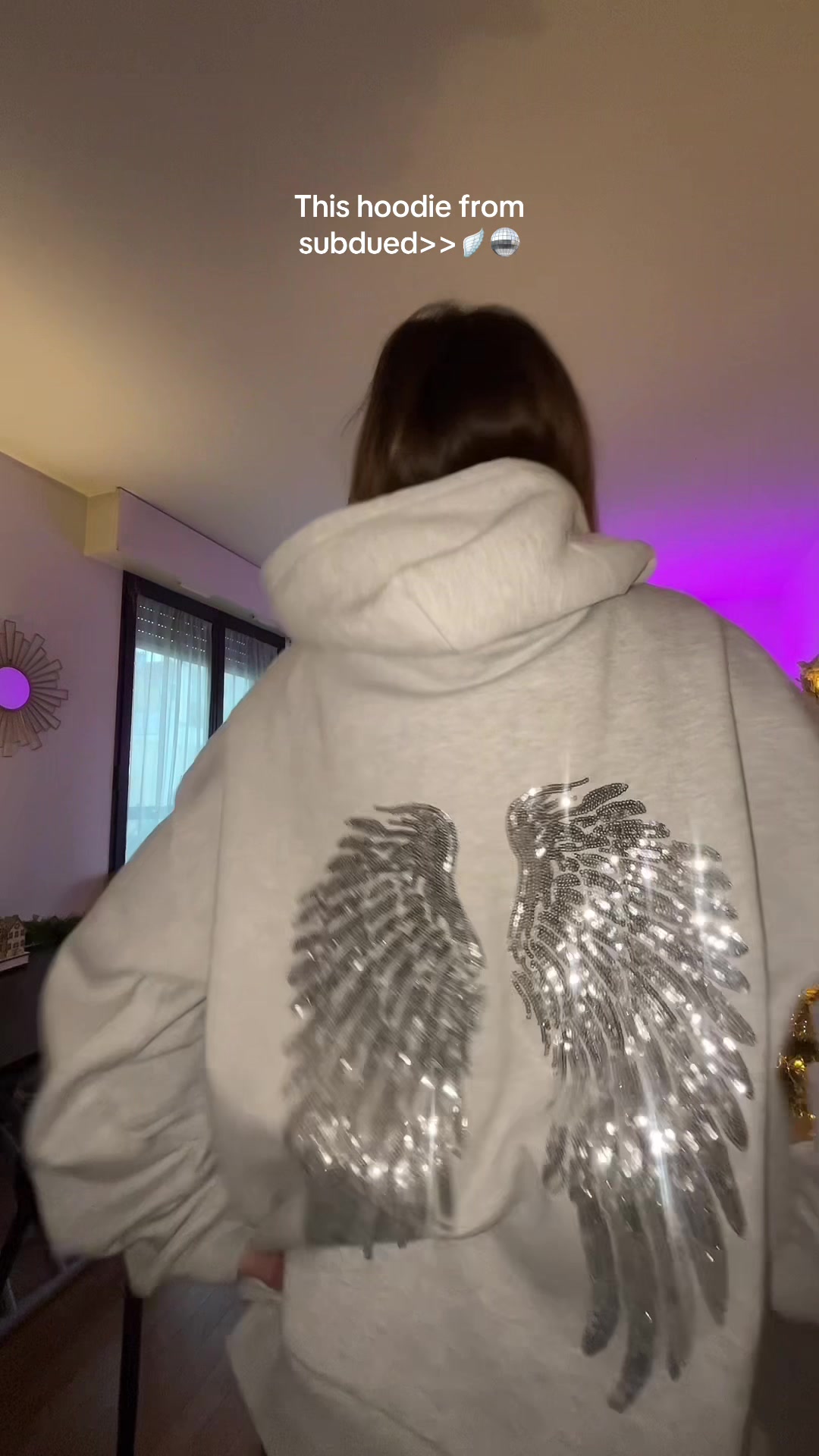 TikTok post by @giulia_.zo for Subdued. Caption reads: @Subdued #fyp #hoodie #subdued #wings #foryoupage .