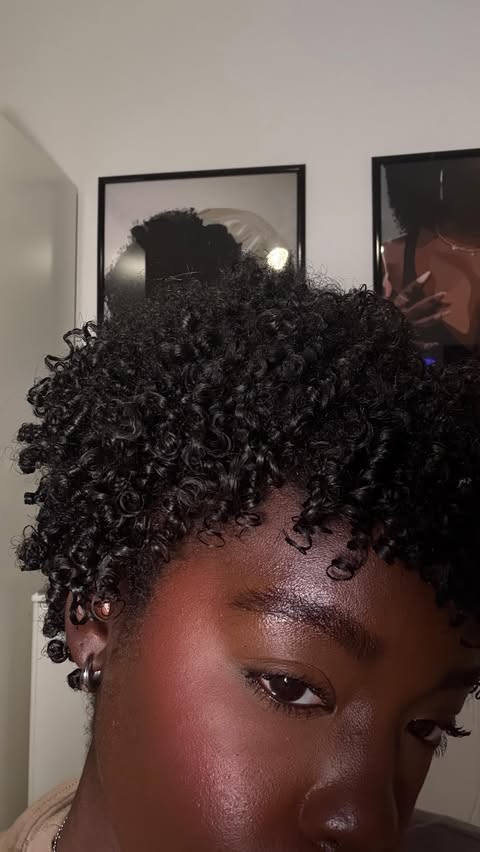 Instagram post by @simonenicolee__ for DevaCurl. Caption reads: [...] out so defined and shiny, thanks to my....