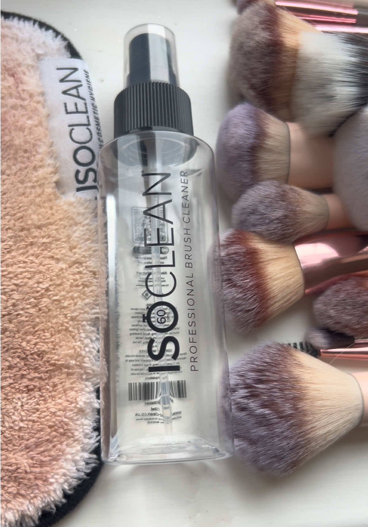 TikTok post by @rach_lang98 for ISOCLEAN. Caption reads: The Magic of @ISOCLEAN ✨ #brushcleaner #isoskin.