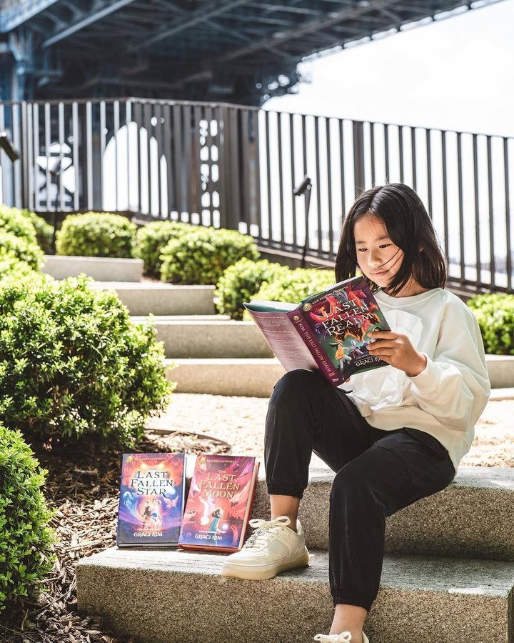 Instagram post by @inrachelshoes for Read Riordan. Caption reads: It’s finally here! Olivia can't wait to dive into....