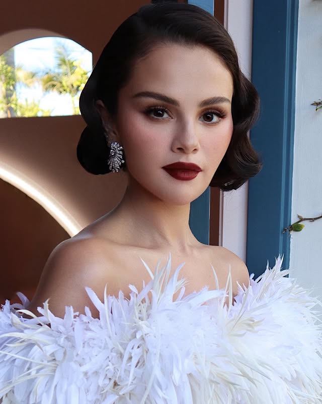 Instagram post by @hungvanngo for Rare Beauty. Caption reads: @SelenaGomez x #GoldenGlobes2026 🖤
👗....