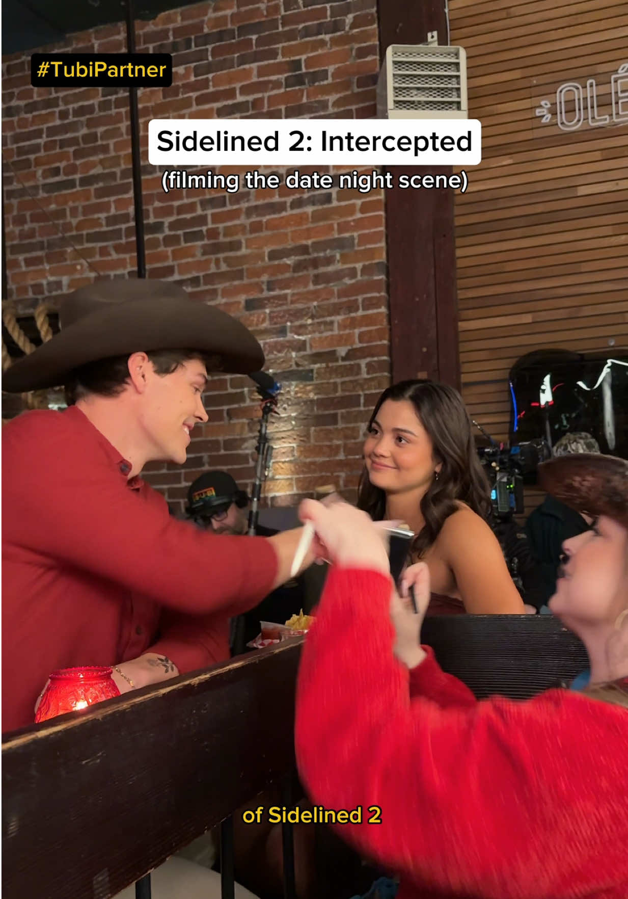 TikTok post by @reaganxo for Tubi. Caption reads: [...] wheeling filming a date night scene)....