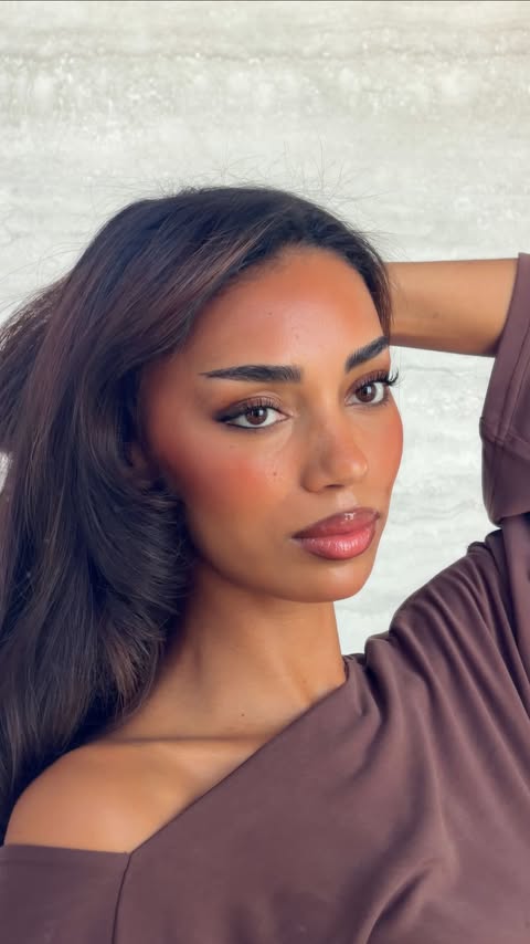 Instagram post by @umajammeh for L'Oréal Paris. Caption reads: Brown eye + brown hair makeup 👁️🤎 Using....