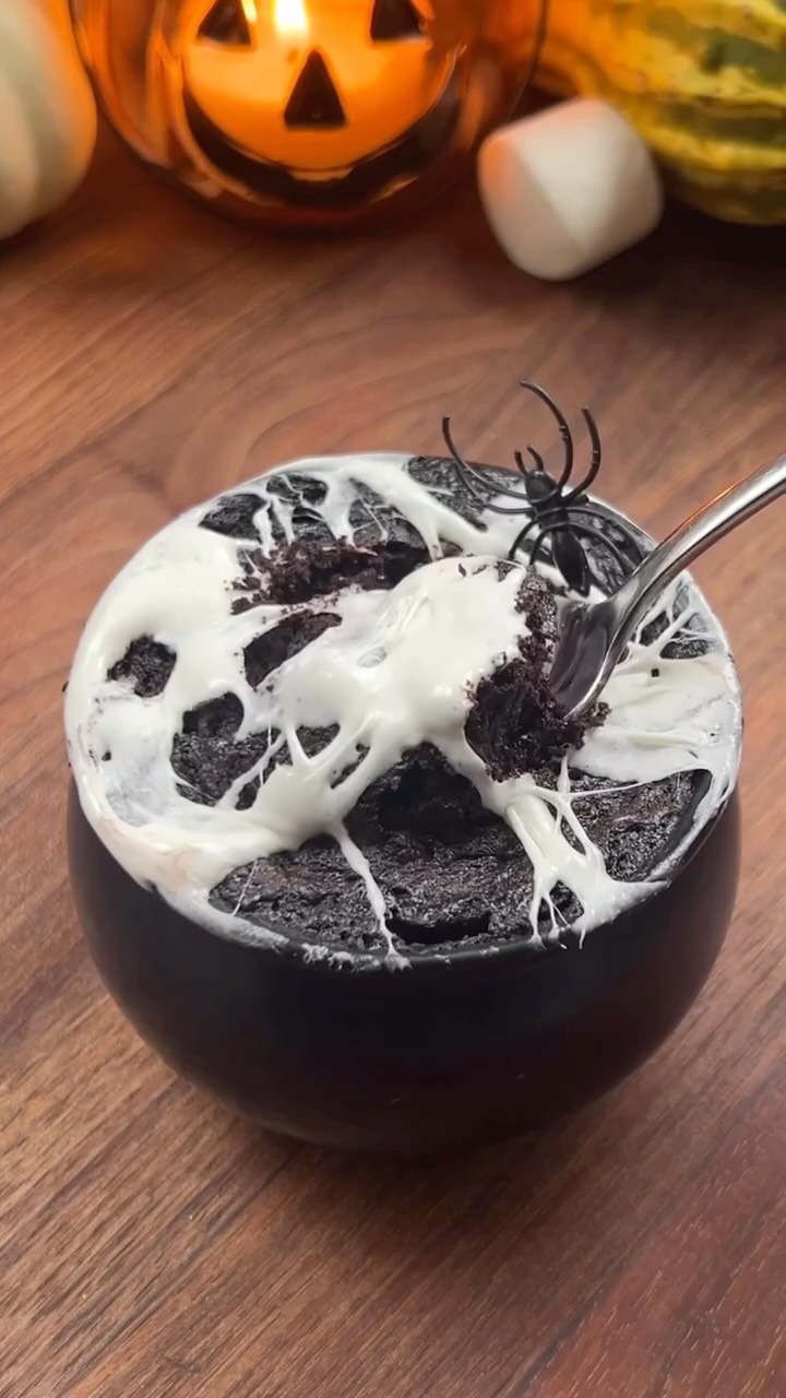 Instagram post by @kelseydeleshaw for The Feedfeed. Caption reads: Black Cocoa Mug Cake 🖤🎃

Ingredients:

1/2 cup....