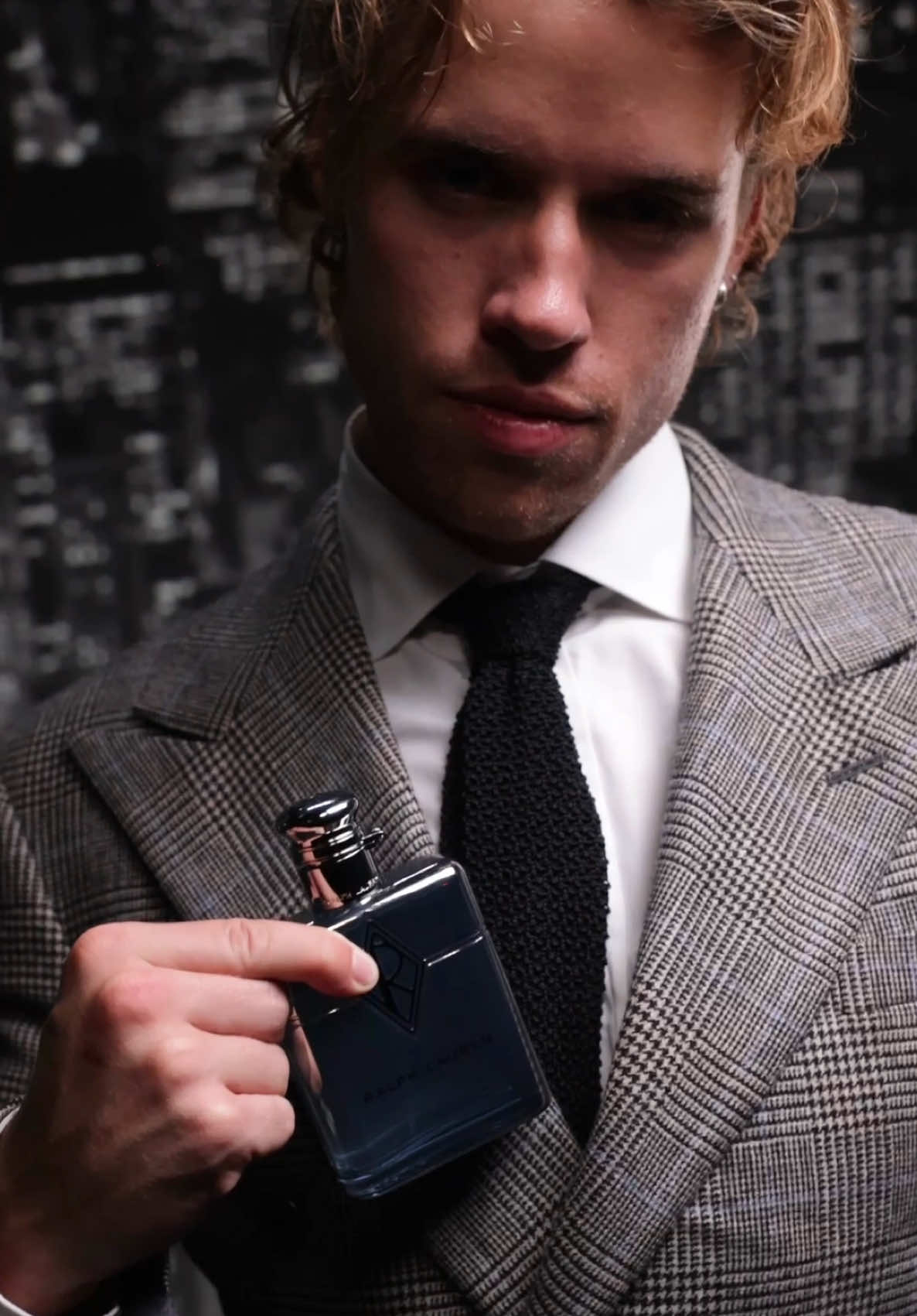 TikTok post by @lucaswhitesmith for The Perfume Shop. Caption reads: Come with me to the launch event for the new....