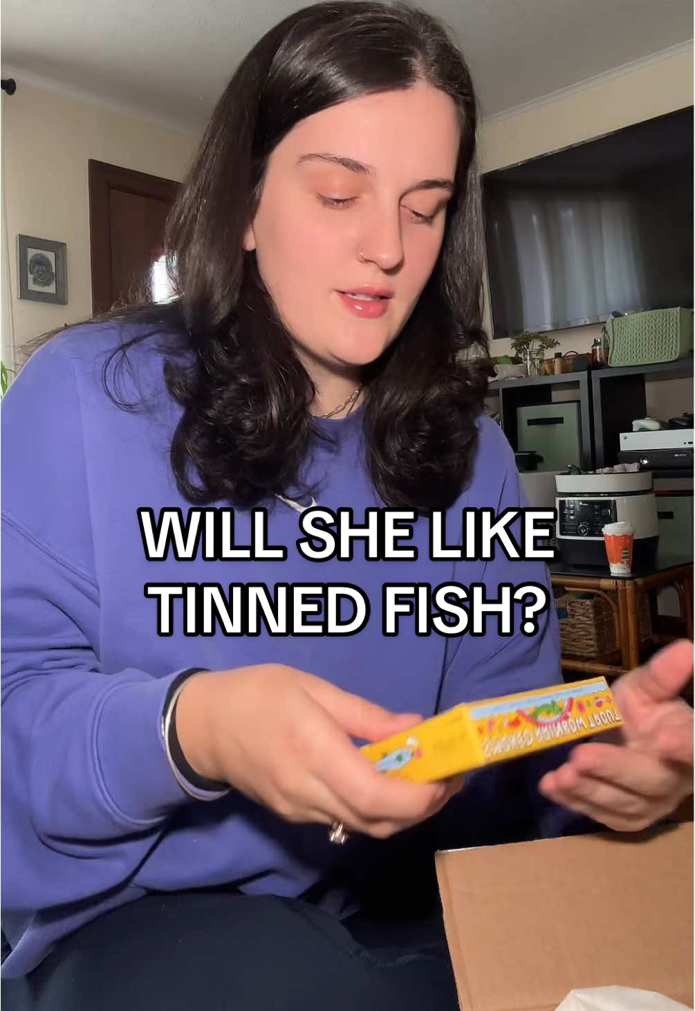 TikTok post by @iz_eatz for Fishwife. Caption reads: Will my baby like tinned fish? 😅🐟🤞🏼 I mean how....