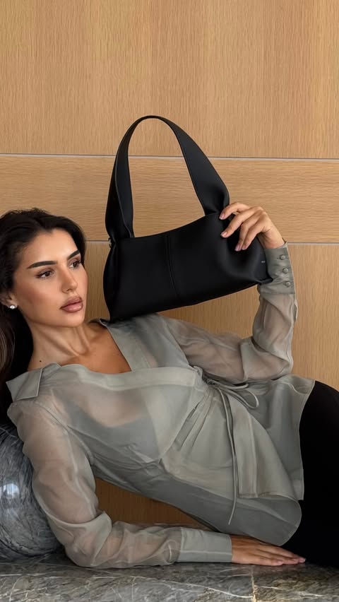 Instagram post by @khadijajoma for POLÈNE. Caption reads: Numéro Neuf East West @polene_paris this bag just....