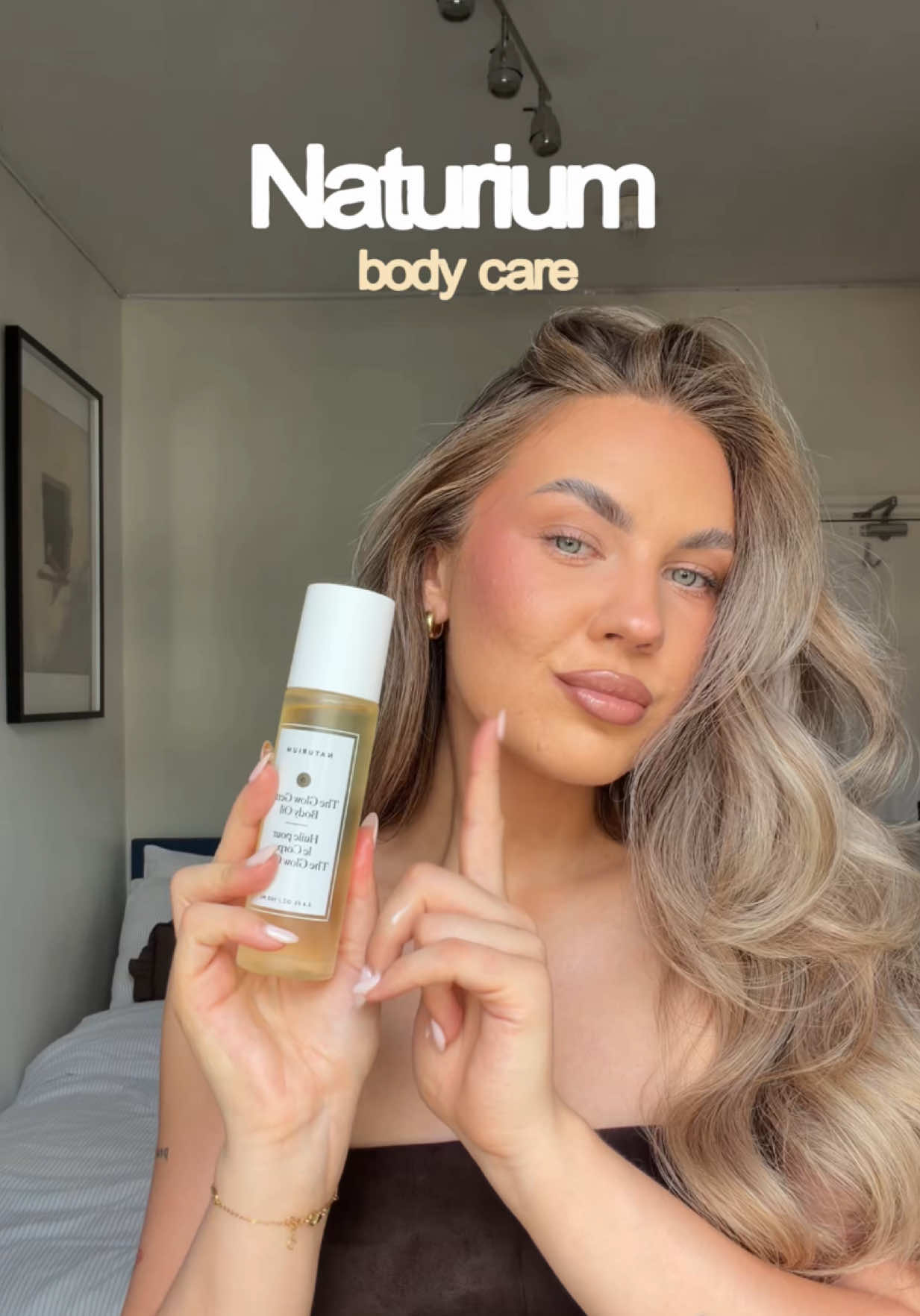 TikTok post by @salneliaa for Naturium. Caption reads: the ultimate @Naturium summer glow body care....