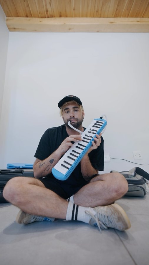 Instagram post by @dannmace for NOMATIC. Caption reads: [...] hate the airport part of traveling, but....