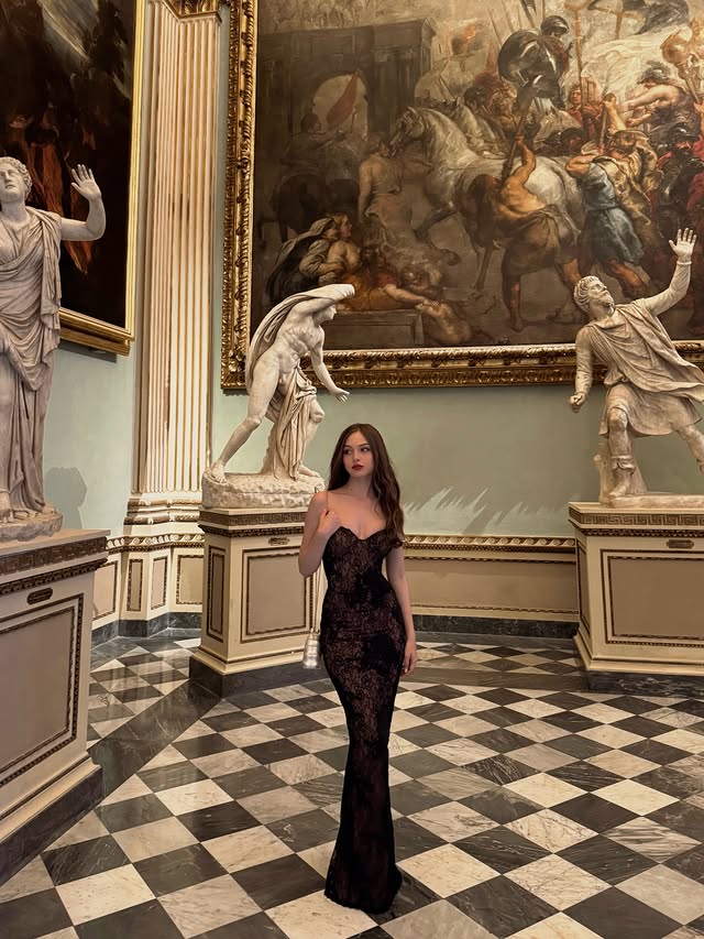 Instagram post by @sabrina_barca for House Of CB. Caption reads: [...] of a museum ♡ Stunning dress from @houseofcb....