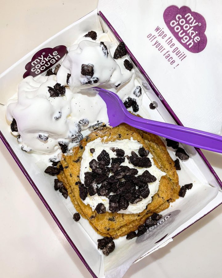 Instagram post by @nyc_to_london for mycookiedough. Caption reads: [...] cookie and eat you dough too. Queue....