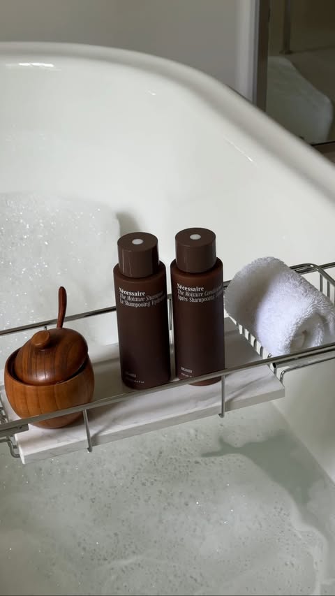 Instagram post by @mayisha.nyc for Nécessaire. Caption reads: Wash days lately and a true review of....