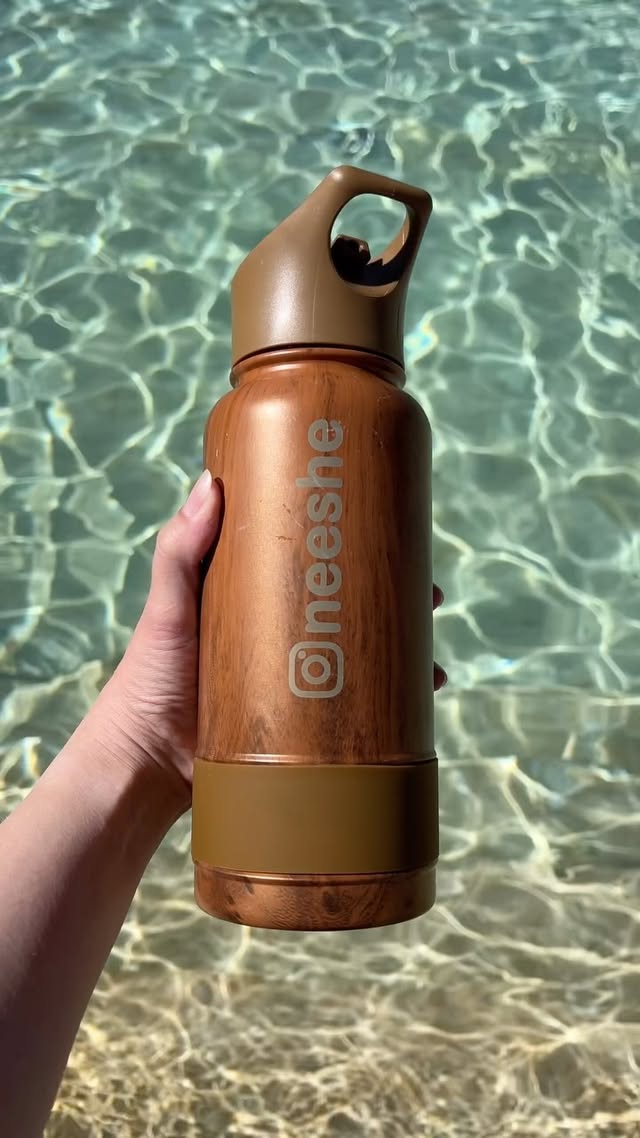 Instagram post by @neeshe for Coldest. Caption reads: #stayhydrated with @thecoldestwater 💧⁣ ⁣ ⁣....
