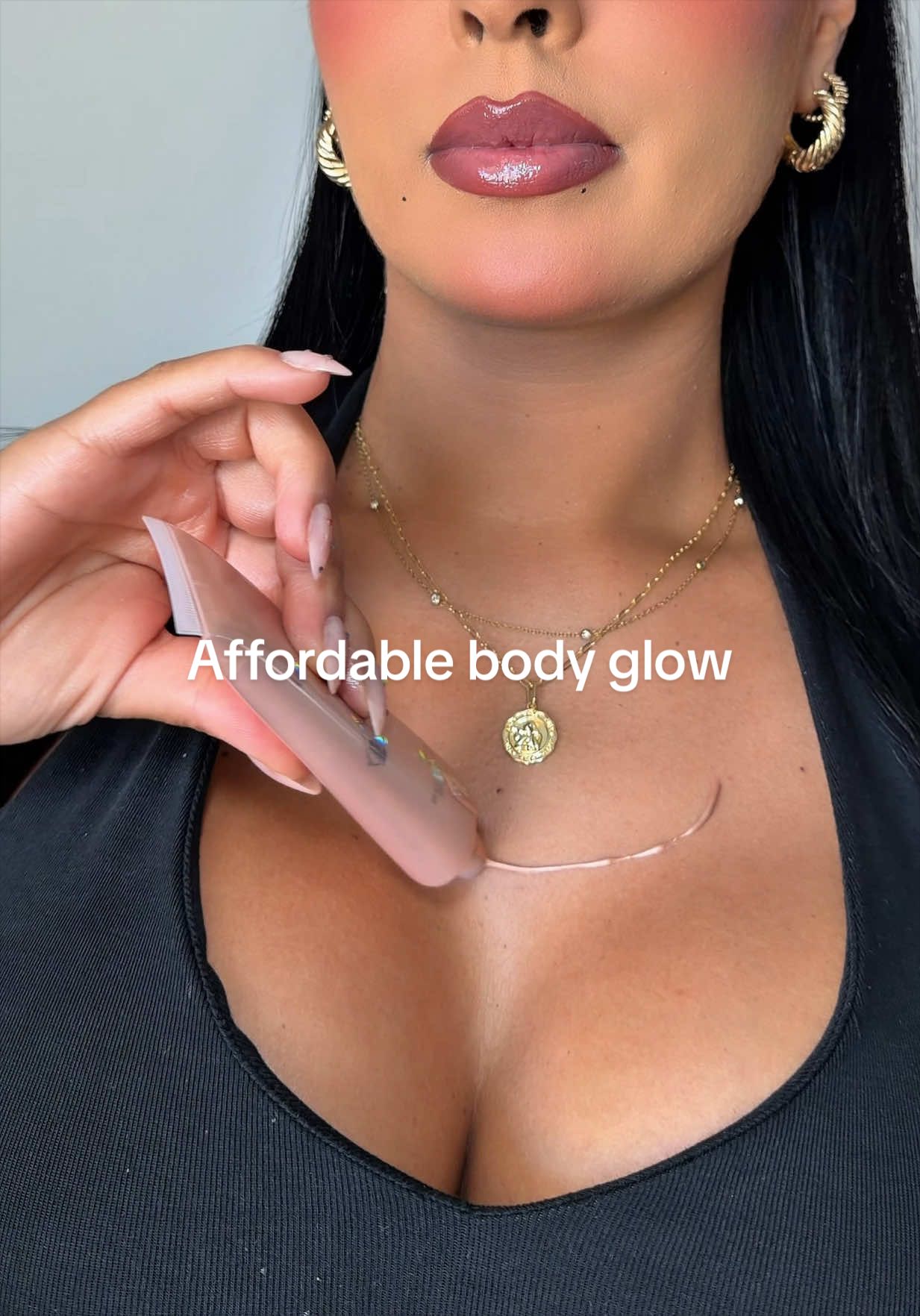 TikTok post by @angiely.goodman for Kara Beauty. Caption reads: Affordable body glow ✨ @Kara Beauty #bodyglow....