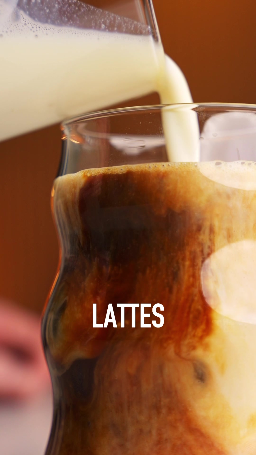 TikTok post by @noahperlofit for GNC. Caption reads: 43g Vanilla Protein Latte‼️ This stuff rocks. I....