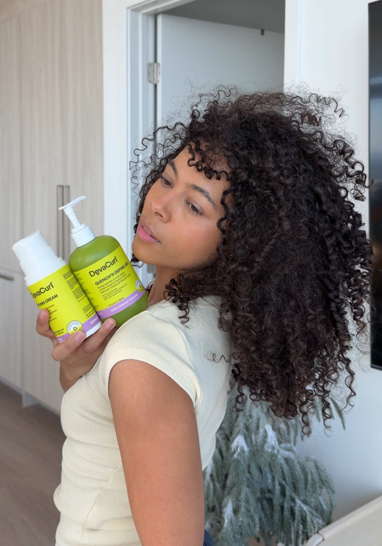 TikTok post by @keyatta.davis for DevaCurl. Caption reads: my easy curly hair routine using @DevaCurl is....