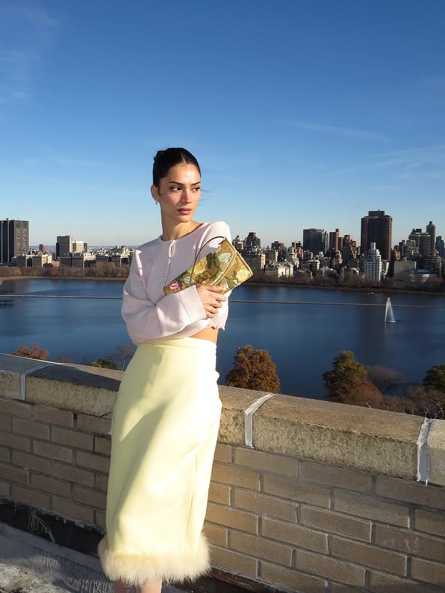 Instagram post by @yesly for Valentino. Caption reads: A little rooftop therapy, wrapped in....