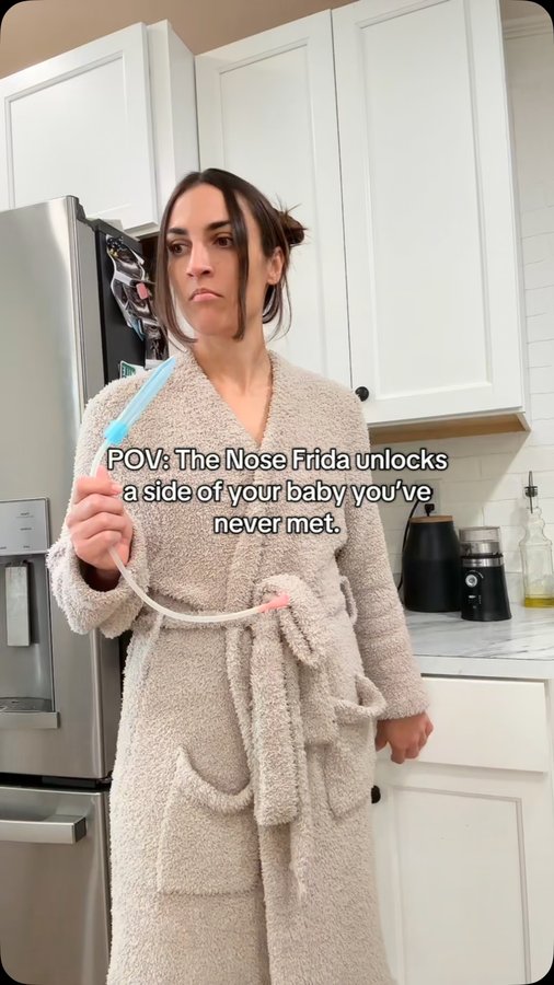 Instagram post by @thatsojakenzy for Frida Baby. Caption reads: The smiling baby on the Nose Frida box is a....