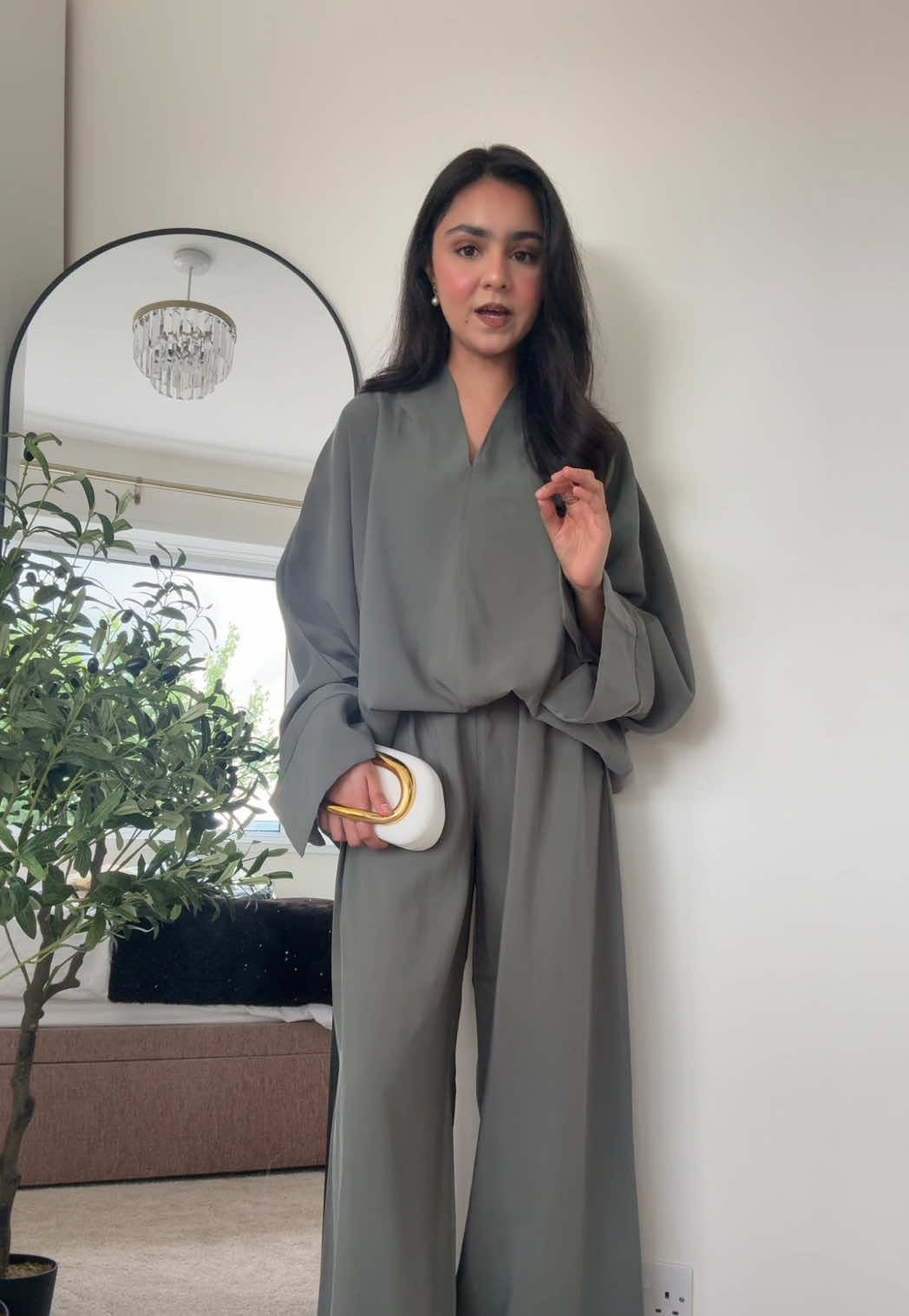 TikTok post by @iitszainabb for emlavish. Caption reads: [...] #modestfashion #emalvish #modestoutfit....