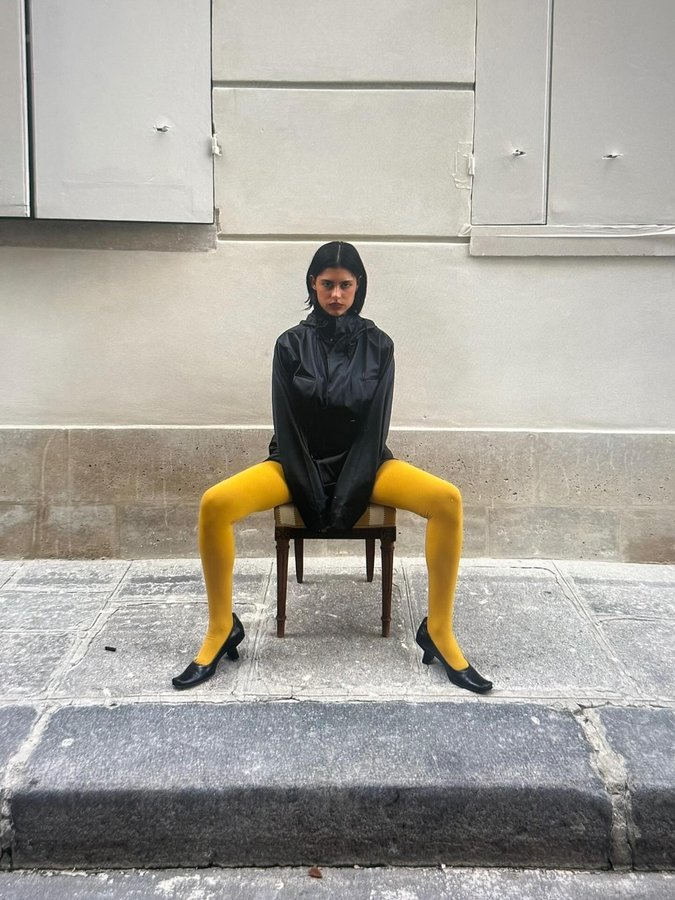 Instagram post by @delfinarodriguezn for Rains. Caption reads: dressed up in rains @zalando ad #zalandostyle....