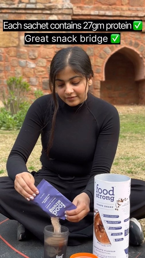 Instagram post by @iam_nidhidixit for foodstrong. Caption reads: [...] protein per serving, from @foodstrong.co The....