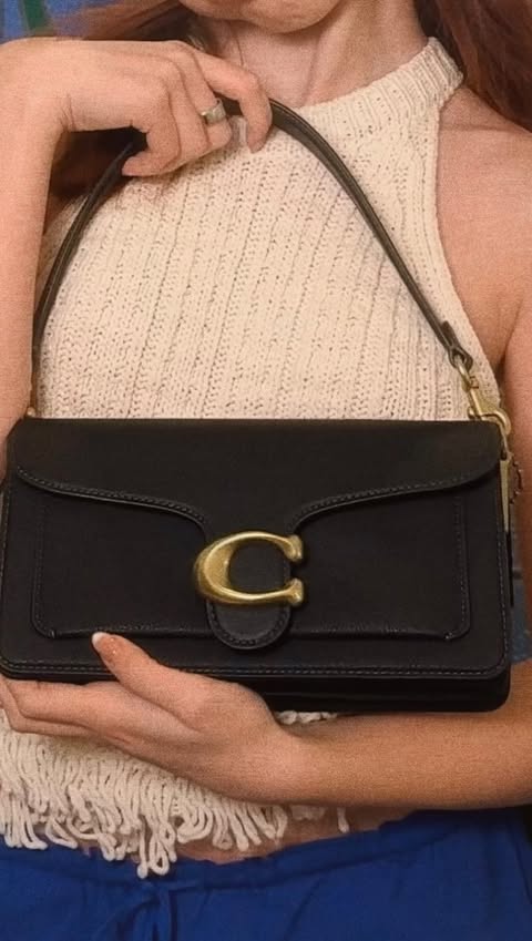 Instagram post by @nikkililly for Coach. Caption reads: a constant 🤍 my everyday @coach tabby goes with....