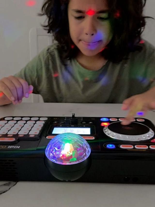 Instagram post by @childblogger for VTech USA. Caption reads: DJ Maxi is in the house thanks to the Vtech Kidi....