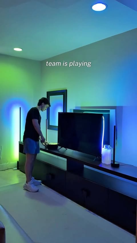 Instagram post by @marcellomazzola7 for Philips Hue. Caption reads: [...] basement setup had to come through⚽️....