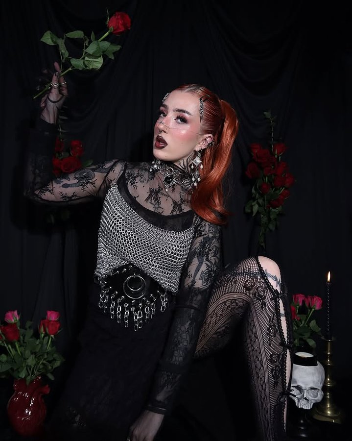 Instagram post by @mimi_almighty for LullaBellz. Caption reads: Valentines self shoot 🥀⛓️‍💥 better late than....