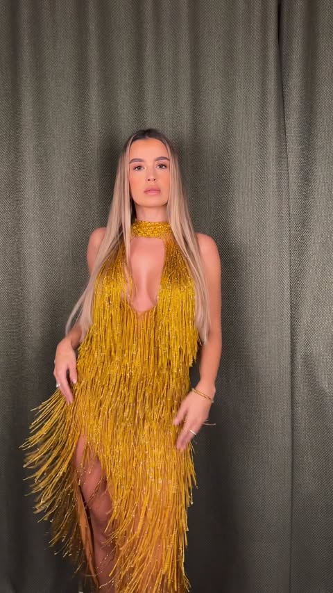 Instagram post by @andreaxamiri for Mew Mews. Caption reads: perfect dress for Christmas or New Year’s Eve >....