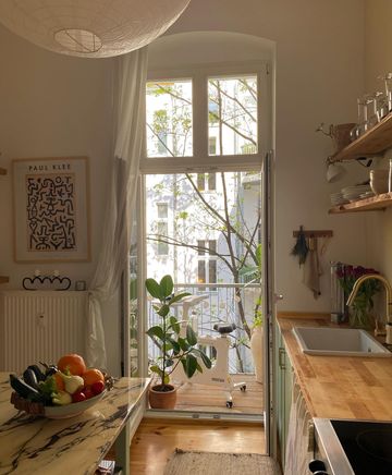 Instagram post by @ekaterynagonchar for FlexiSpot. Caption reads: Workspace in summer time — A new update to the....