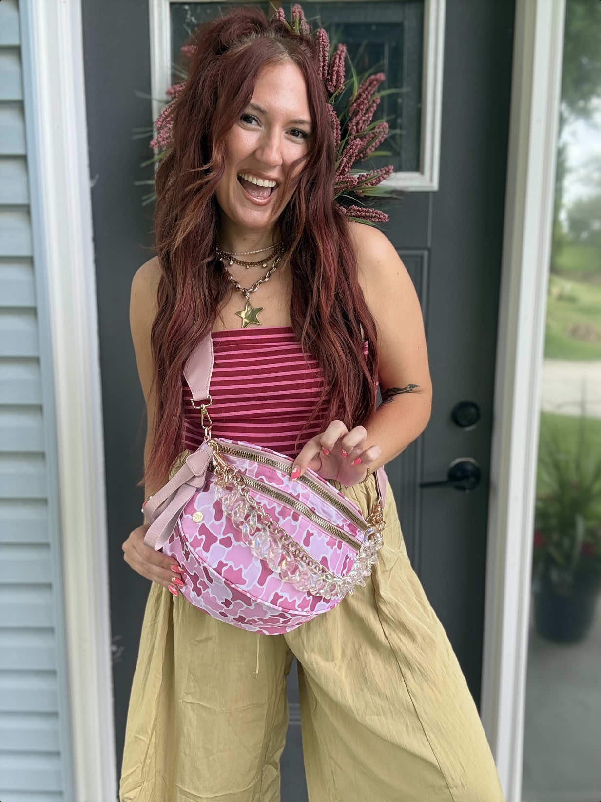 TikTok post by an influencer for Gold Blush. Caption reads: Pink Camo 😍💖 @Gold Blush #goldblush #bumbag....