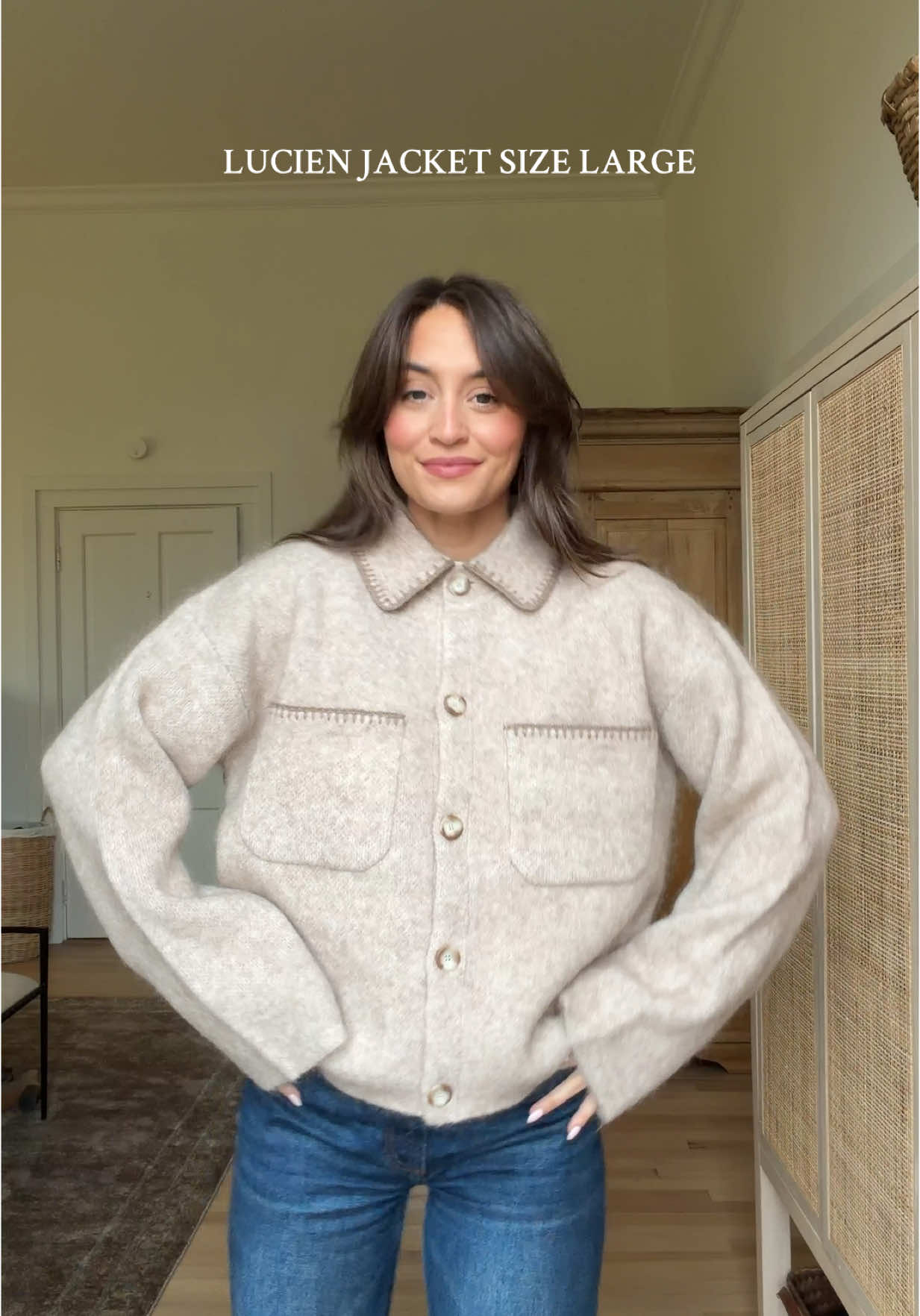 TikTok post by @kristinjohnss for Sezane. Caption reads: [...] package arrives ❤️ linked everything in my....