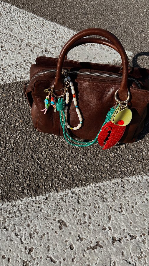 Instagram post by @caitlynlapp for Latico Leathers. Caption reads: fall is that you ???

new purse from....