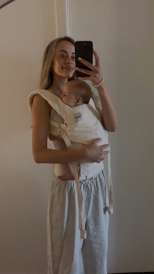 Instagram post by @emdavies___ for Baby Tula. Caption reads: Matching my carrier to my outfits >>> @babytulaanz....