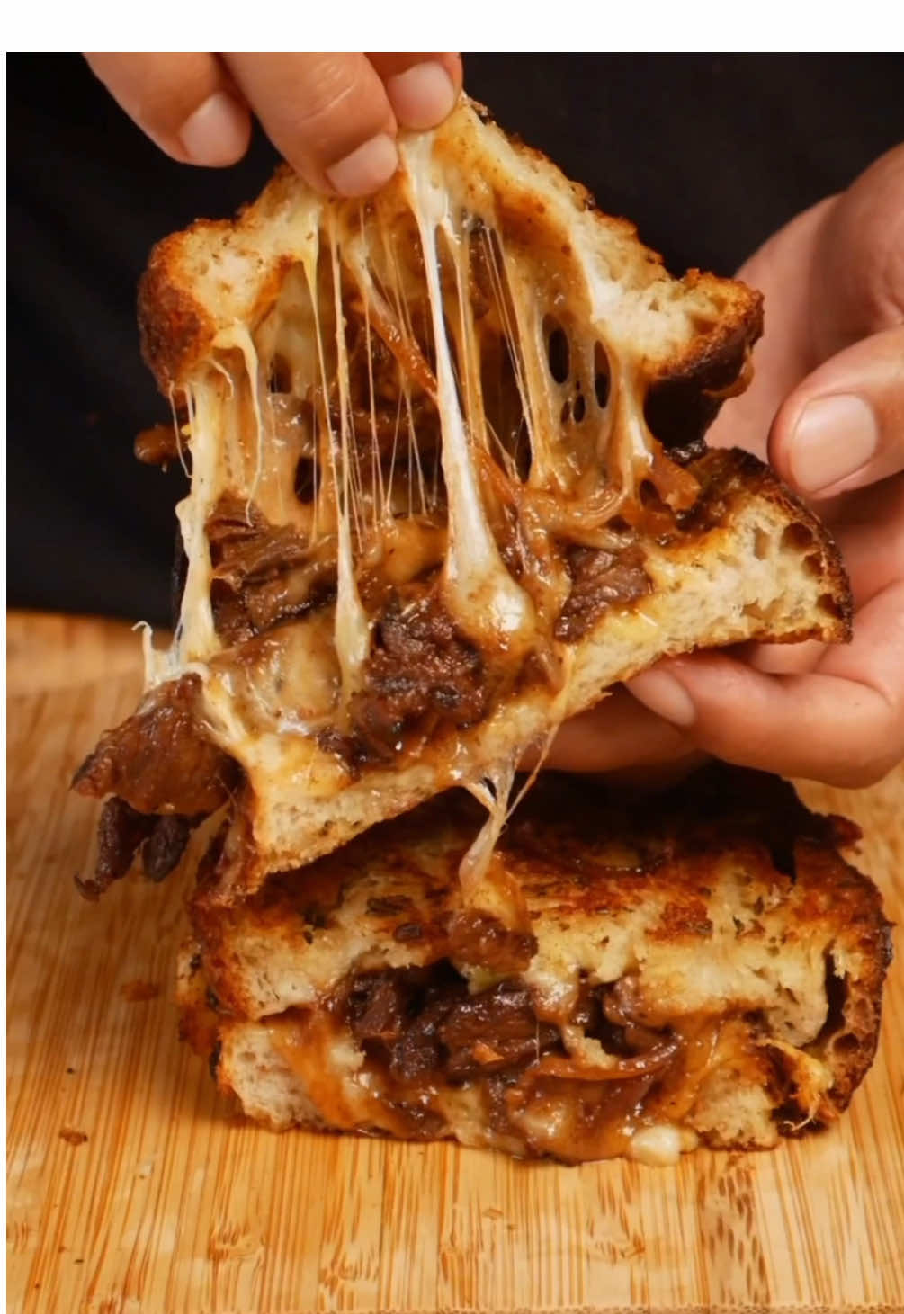 TikTok post by @thejoemustgoon for Tillamook. Caption reads: Bulgogi Grilled Cheese Recipe 🥩🧀 With bold and....