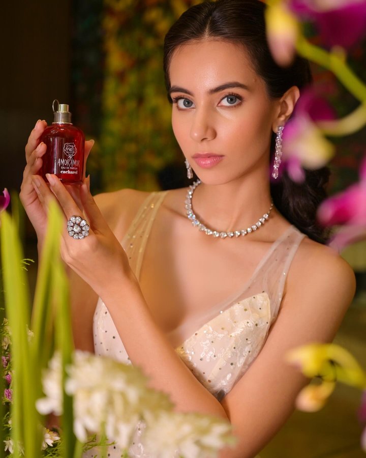 Instagram post by @allabout_eshaa for Cacharel Parfums. Caption reads: Spring is officially here! Fresh blooms, sunshine....