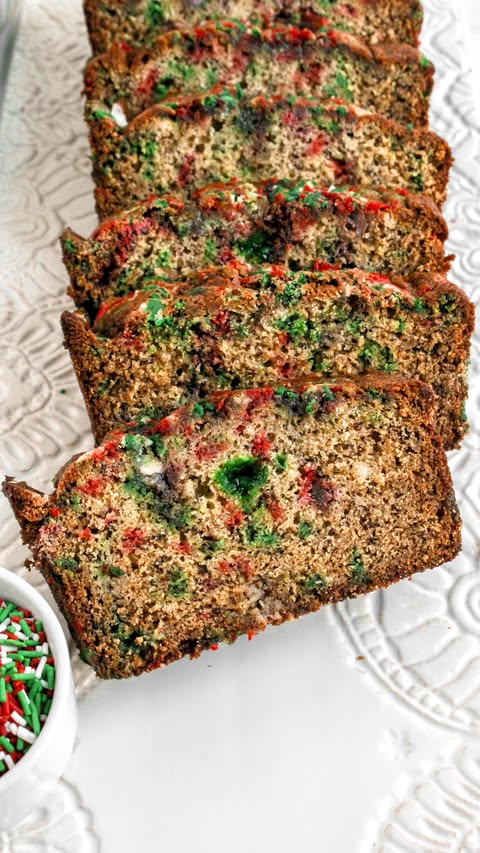 Instagram post by @mymessykitchenn for Fancy Sprinkles. Caption reads: #ad This festive banana bread gets its color,....