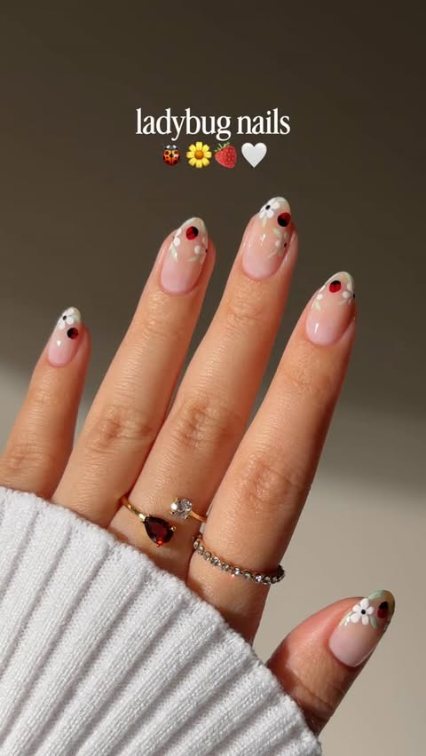 Instagram post by @bycheznails for ella+mila. Caption reads: [...] nail art: ladybug nails edition with....