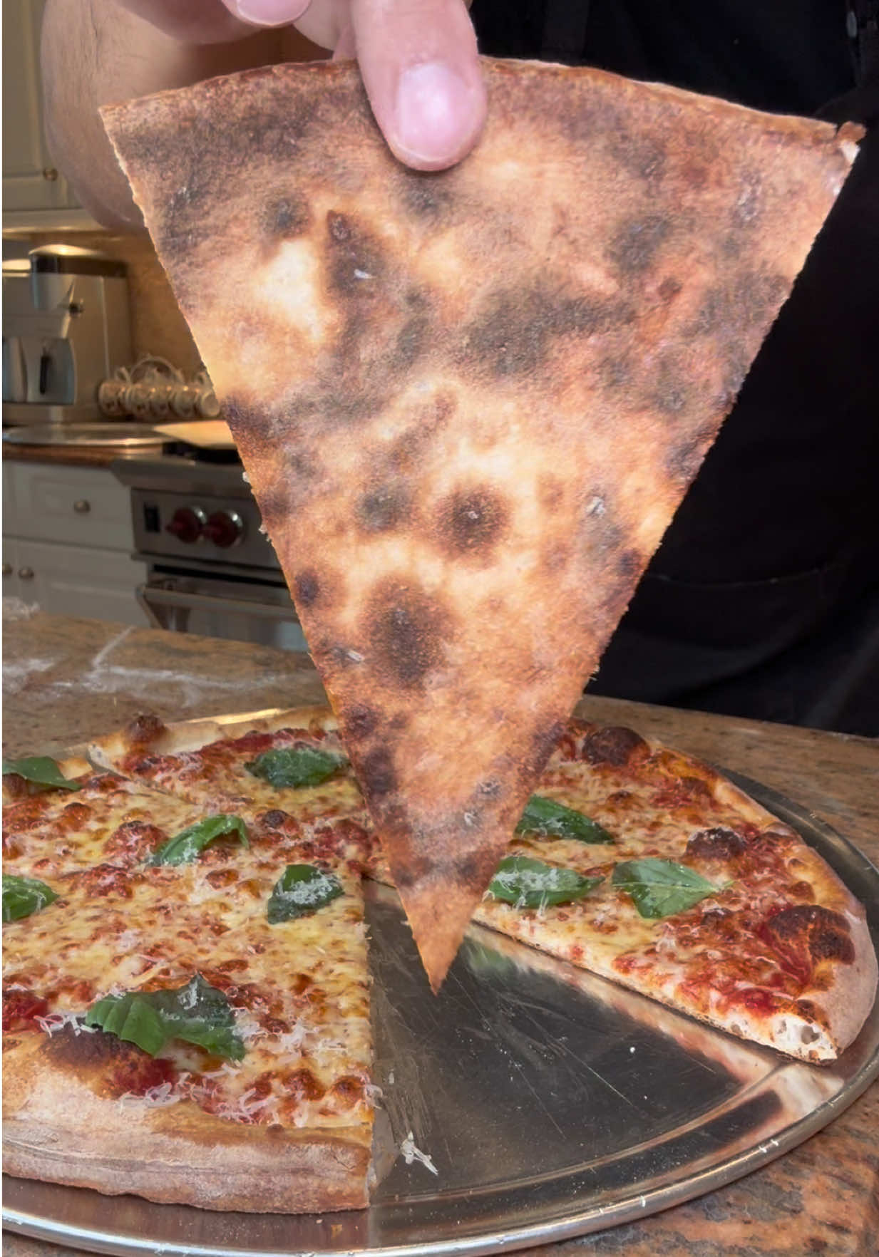 TikTok post by @theloveofpizza for Baking Steel. Caption reads: Homemade 16 inch pizza baked on my baking....