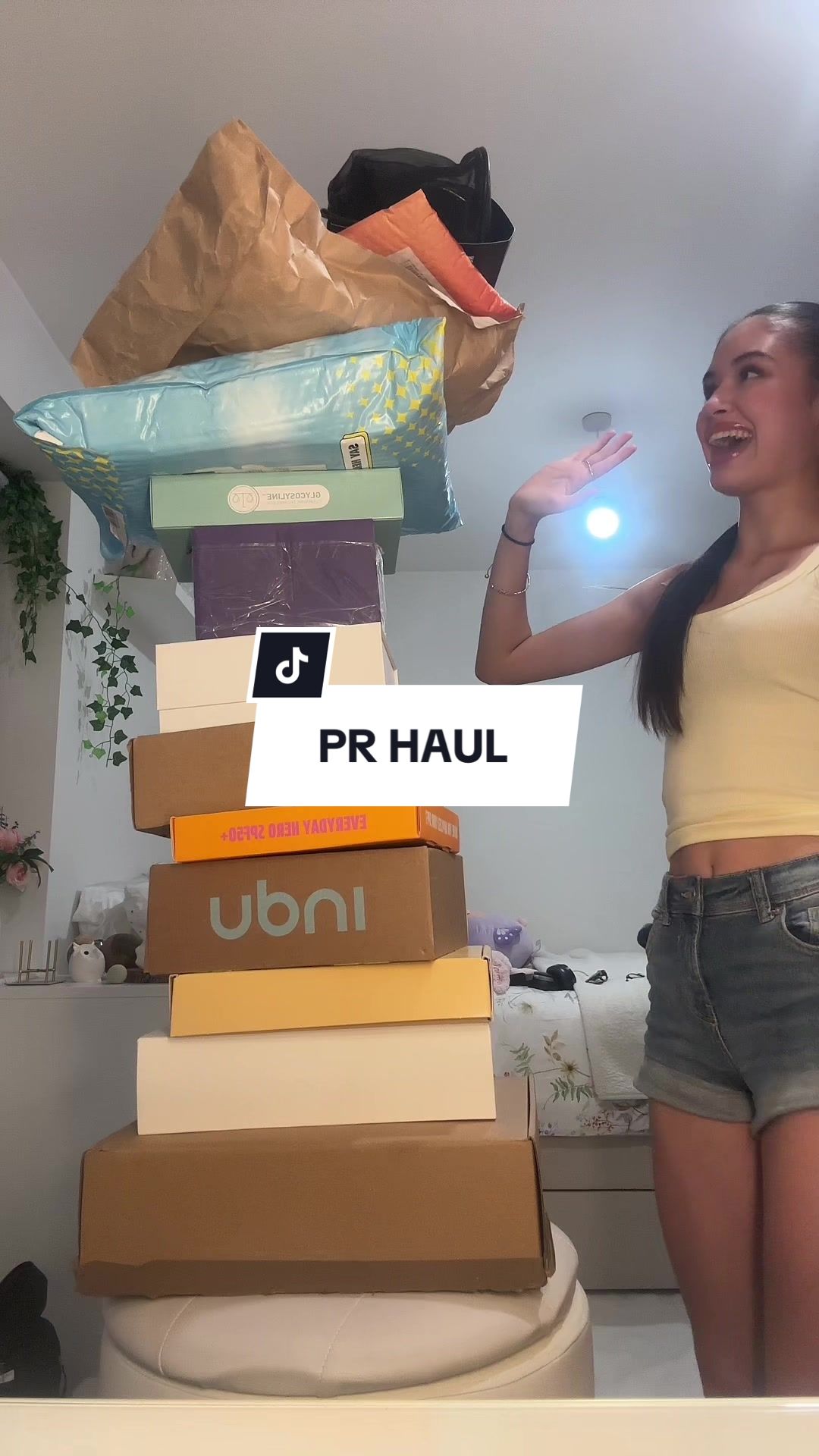 TikTok post by @yasmintibes for Makeup Revolution. Caption reads: Not the tag on my top still being on 😭 #prhaul....