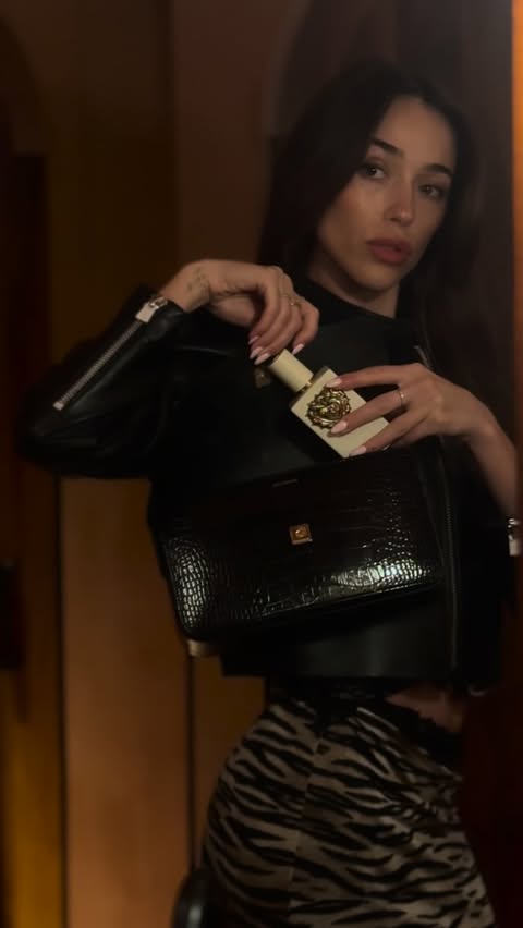 Instagram post by @sophiaculpo for Dolce&Gabbana Beauty. Caption reads: Date night isn’t complete without one last spritz....