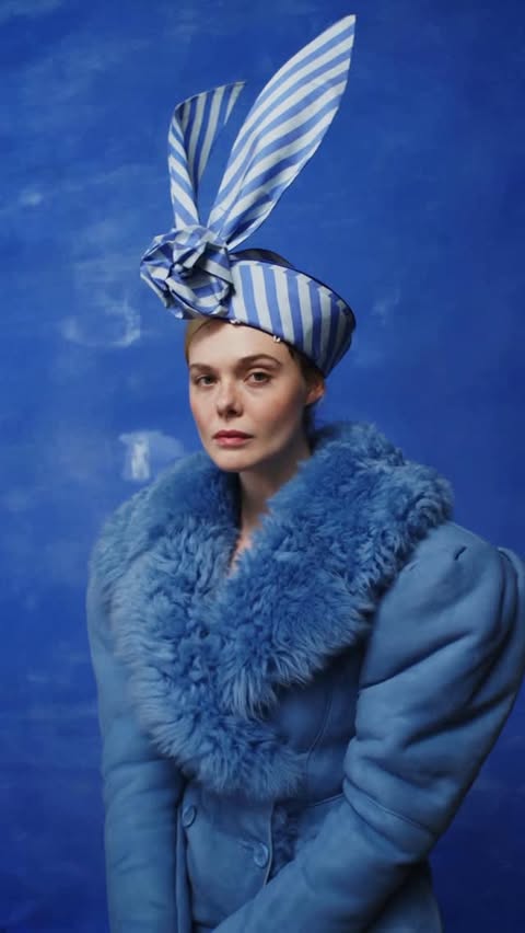 Instagram post by @ellefanning for Who What Wear. Caption reads: Lights, camera, cats! @ellefanning is draped in....