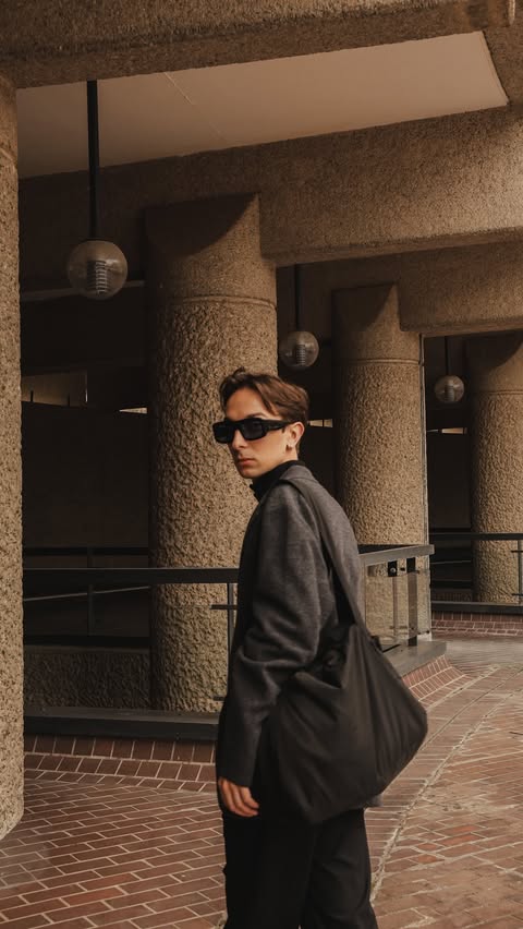 Instagram post by @fashionwhisper for UNIQLO. Caption reads: [...] me. Most of my wardrobe consists of....