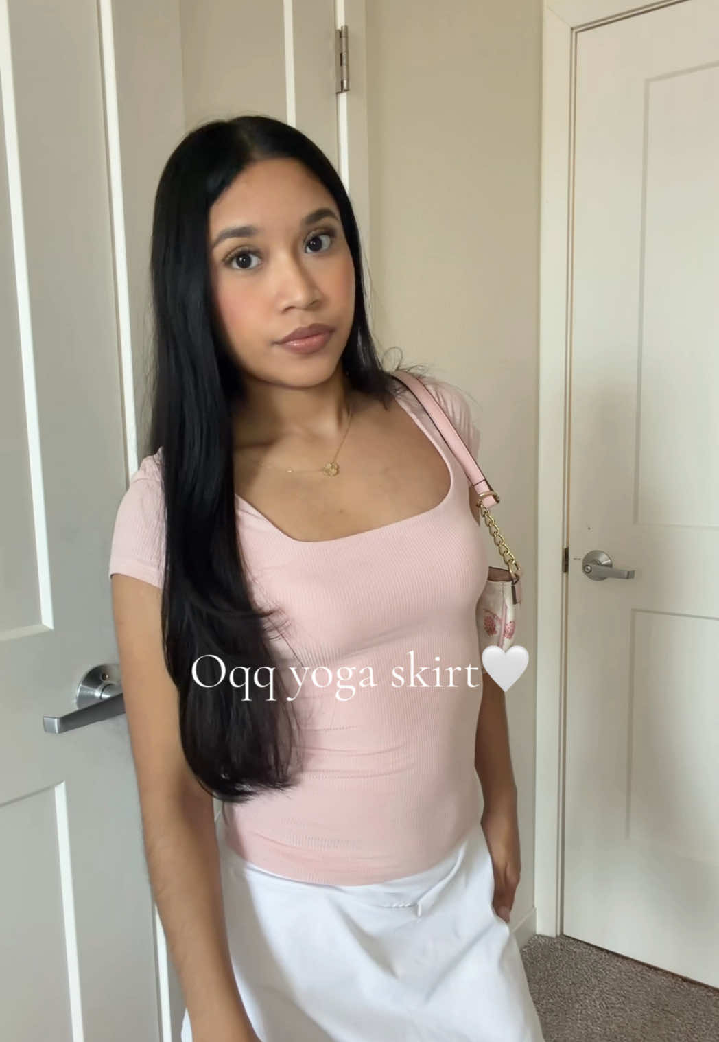 TikTok post by @andrea.alv_ for OQQ. Caption reads: Love this skirt with built in shorts🤍✨ @OQQ-Nine....
