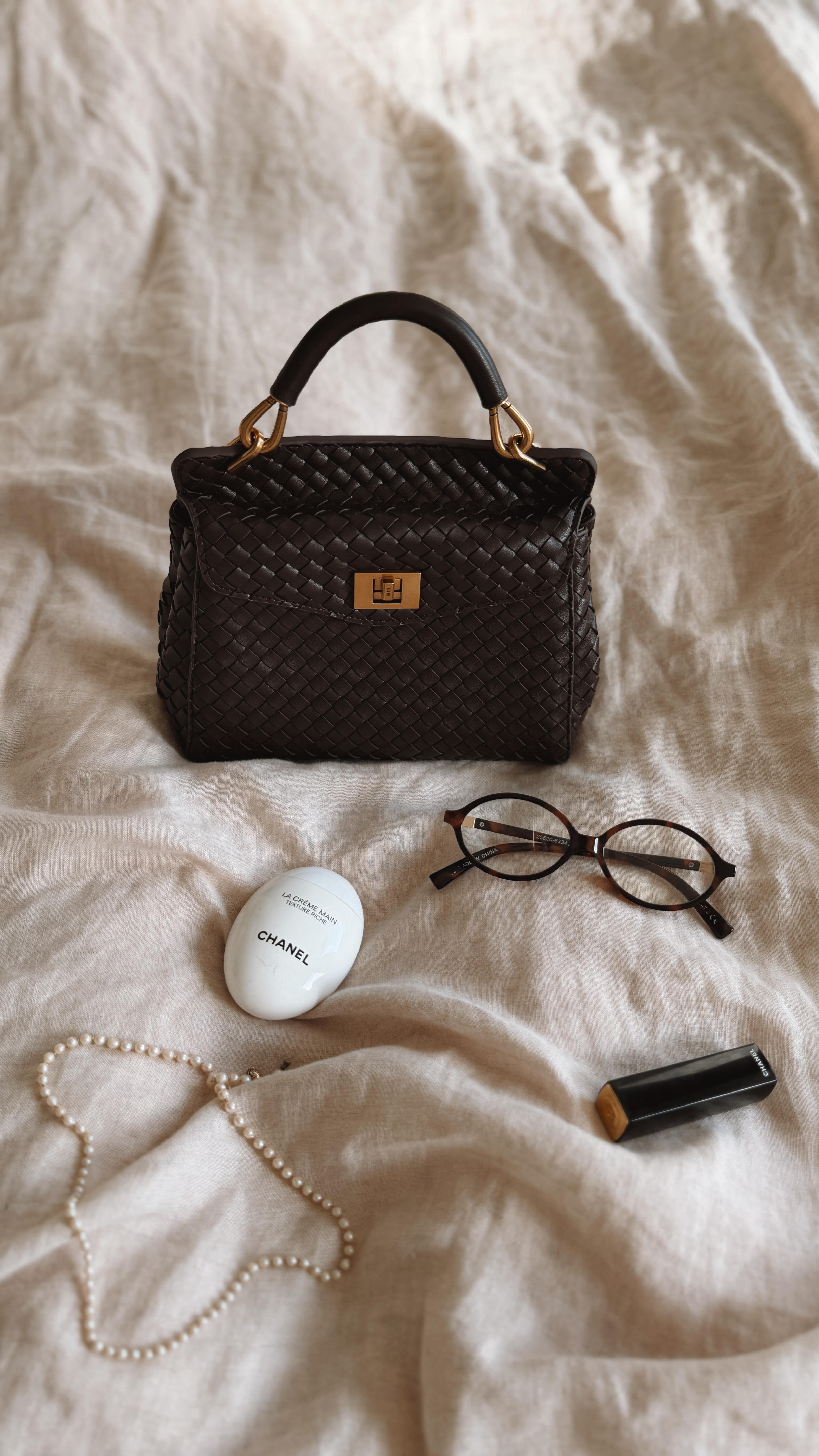 Instagram post by @rosemaria_b_ for JW PEI. Caption reads: Ad ~ just unboxed the cutest little bag from....