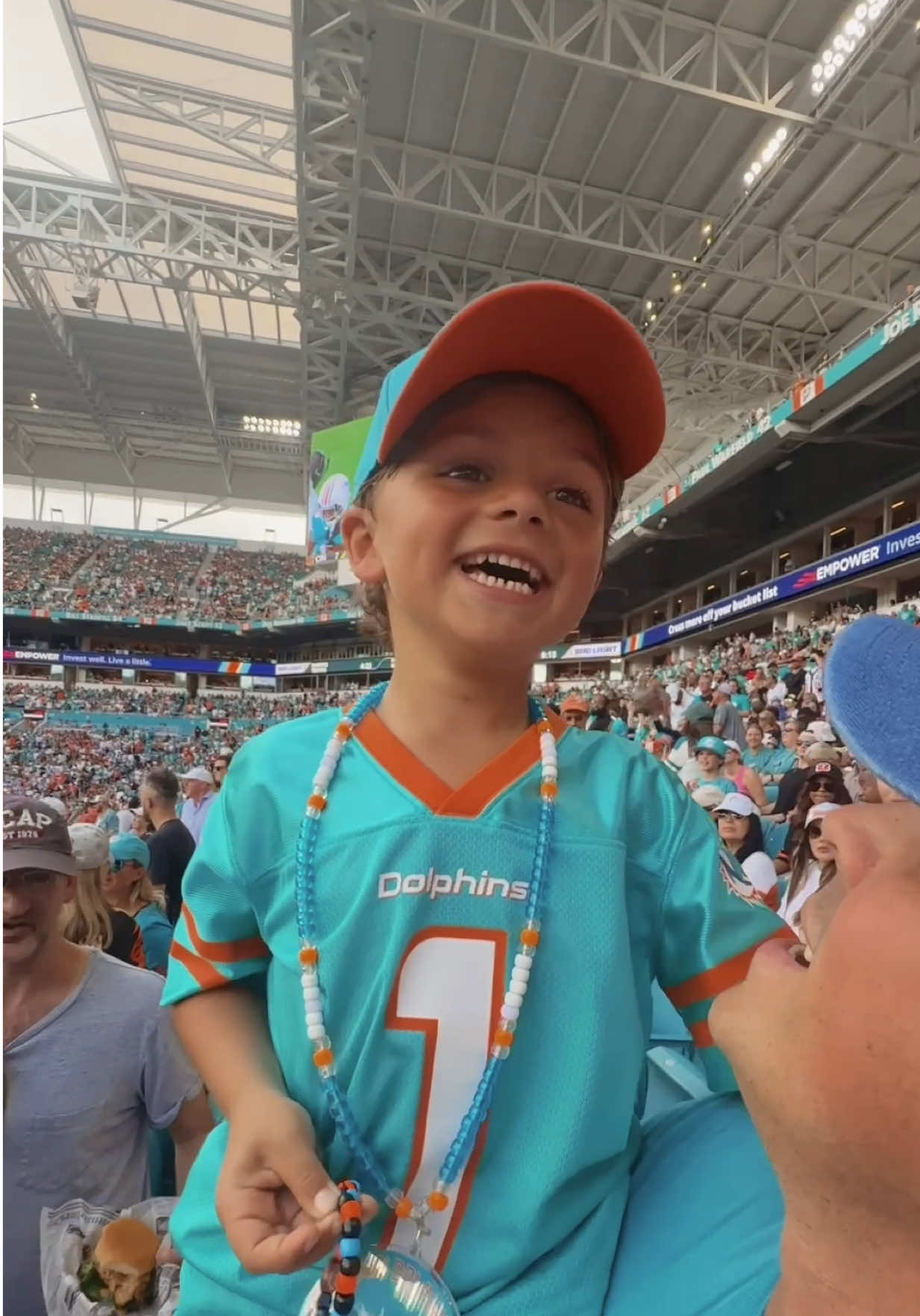 TikTok post by @fabiolamillican for TickPick. Caption reads: [...] #toddlersoftiktok #nfl #miamidolphins....