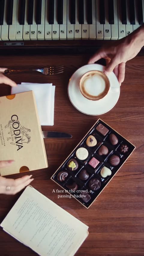 Instagram post by an influencer for GODIVA. Caption reads: [...] act of opening a box of @godiva, letting the....