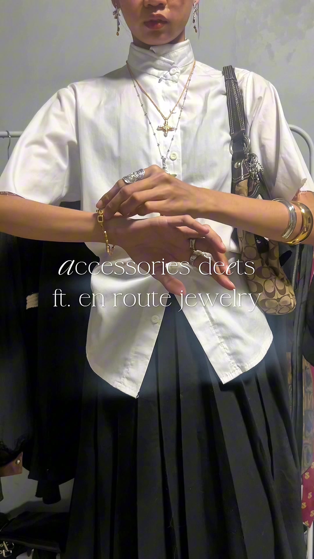 TikTok post by @strvash for En Route Jewelry. Caption reads: accessories that make the fit 🔑 @en route jewelry....