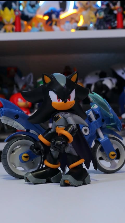 Instagram post by @nostalgicadam for JAKKS Pacific. Caption reads: [...] can win this Batcycle!!FOLLOW....